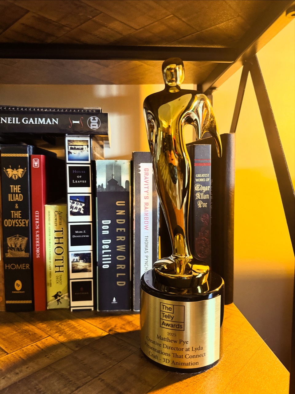 Matthew Pye’s 2025 Telly Award on his bookshelf
